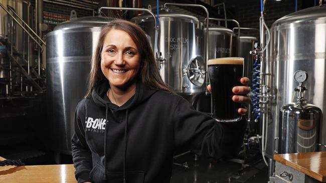 Owner and marketing manager of T-Bone Brewing Co in North Hobart Cala Bignell with their popular Choc Milk Stout. Picture: Zak Simmonds