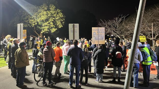 A large group met outside the chambers after the meeting was closed to the public and moved online amid safety concerns. Picture: Nilsson Jones