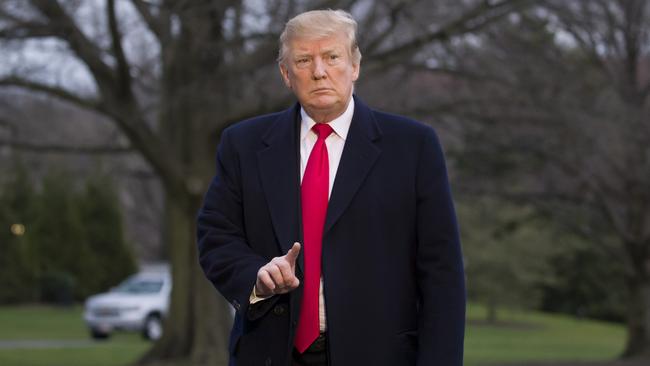 President Donald Trump gestures after stepping off Marine One on the South Lawn of the White House, Sunday, March 24, 2019, in Washington. The Justice Department said Sunday that special counsel Robert Mueller's investigation did not find evidence that President Donald Trump's campaign "conspired or coordinated" with Russia to influence the 2016 presidential election. (AP Photo/Alex Brandon)