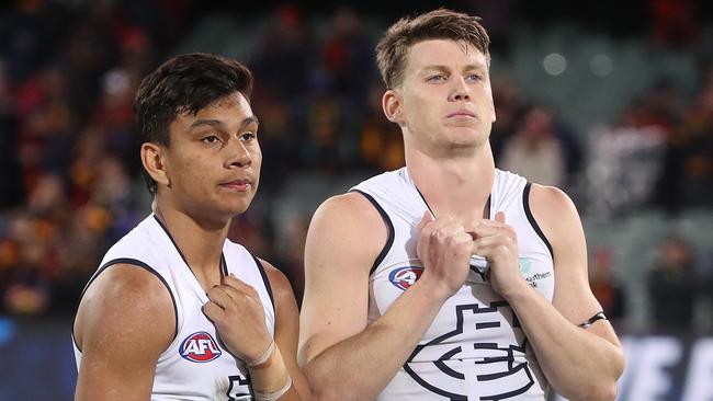 Jesse Motlop and Sam Walsh after Carlton’s loss to Adelaide. Picture: Sarah Reed/AFL Photos via Getty Images