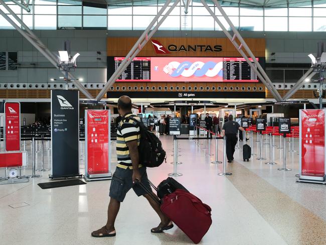 SYDNEY, AUSTRALIA : NewsWire Photos - SEPTEMBER 30 2024 ; A general view of the Qantas terminal at the Sydney Domestic Airport as Qantas engineers again walk out on the job over alleged pay disputes. A number of Qantas engineers Ã including maintenance engineers, who tow and marshall aircraftÃs Ã are set to walk off the job from 7am until 9am on Monday as strike action remains ongoing since Thursday. Brisbane, Sydney, Canberra, Melbourne, Adelaide, and Perth airports are all expected to be affected by the action, which has been brought on by increased calls for better pay. Picture: NewsWire / Gaye Gerard