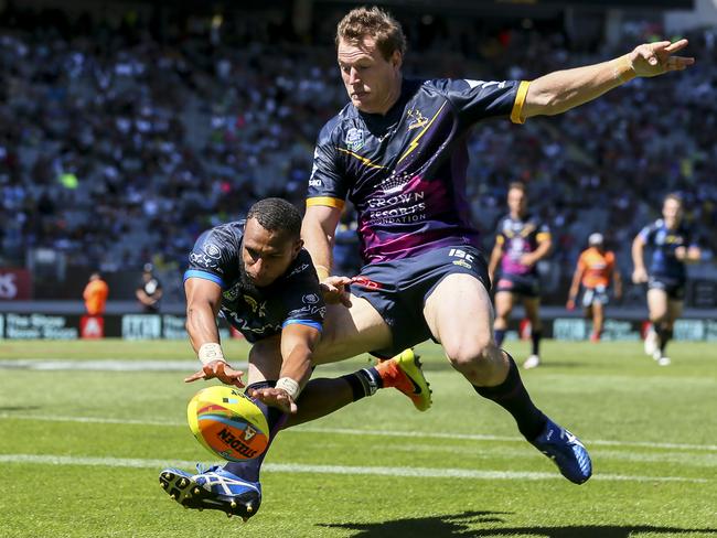 Gideon Gela-Mosby scores a try despite the tackle of Tim Glasby during an Auckland Nines clash between the North Queensland Cowboys and the Manly Sea Eagles. Picture: Getty Images