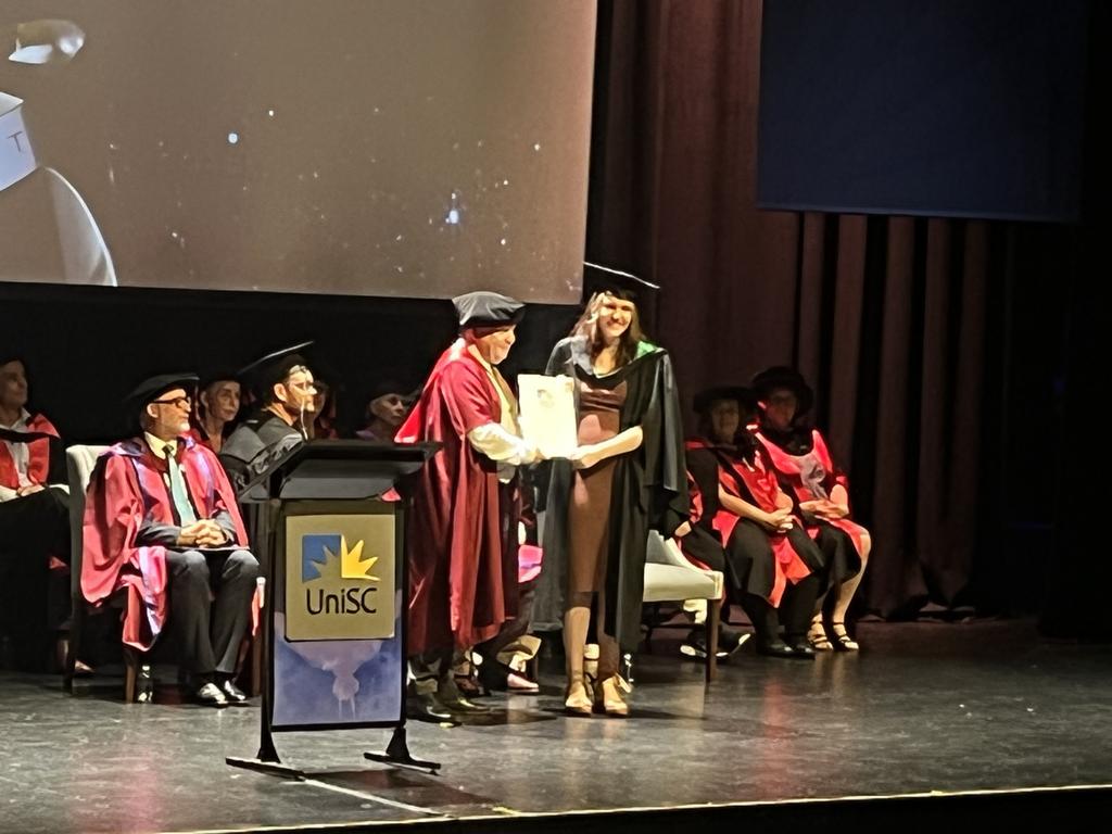 Graduates from the University of the Sunshine Coast's Fraser Coast campus celebrating at the Brolga Theatre.