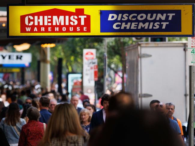 SYDNEY, AUSTRALIA - NewsWire Photos, October 29 2024. GENERIC. Inflation. Shopping. Retail. Economy. Cost of living crisis. Crowded footpath beneath a Chemist Warehouse sign. Picture: NewsWire / Max Mason-Hubers