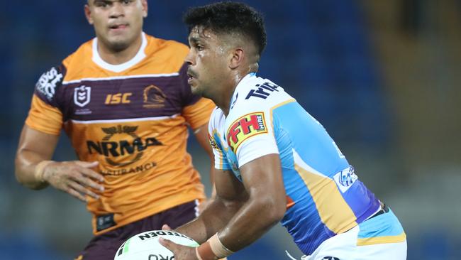 Titants recruit Tyrone Peachey looks to pass the ball against the Broncos on Saturday night. Picture: Getty Images