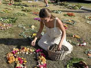 IN MOURNING: Lucy Hackett lay flowers at the memorial. Picture: Kathryn Lewis