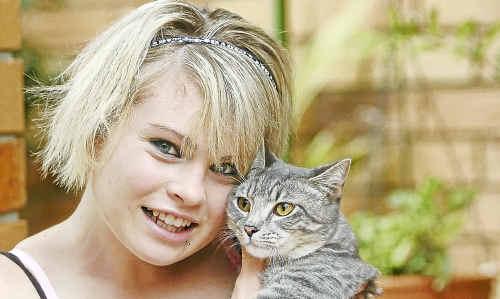 Renae Keyes and little Tinkerbell were reunited after the RSPCA linked the pair via a microchip. Picture: Mike Knott