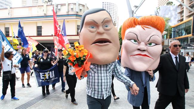 Protestors dressed as caricatures of Queensland Opposition Leader Tim Nicholls and One Nation Leader Senator Pauline Hanson are seen as unionist march in Brisbane.  Picture: AAP Image/Jono Searle