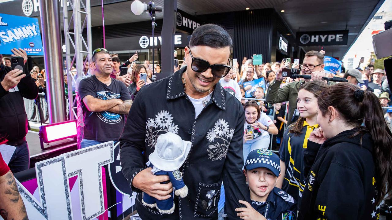 Sam, who wants to be a Policeman, arrested Singer-songwriter, Guy Sebastian in Rundle Mall. Picture: Tom Huntley