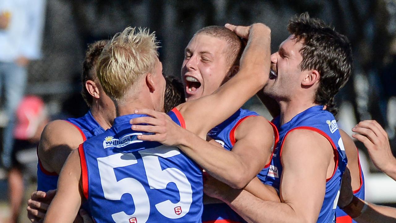 Adam Deakin, middle, celebrates a goal against North Adelaide. Picture: Brenton Edwards