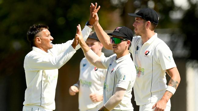 Robbie Lancaster of Bonbeach celebrates taking a wicket. (Photo by Josh Chadwick)