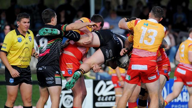 Sawtell forward Sam Johnstone held in a strong tackle. Picture: Leigh Jensen