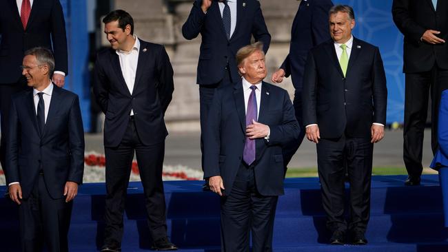 Donald Trump stands tall in a group line-up. Picture: AFP