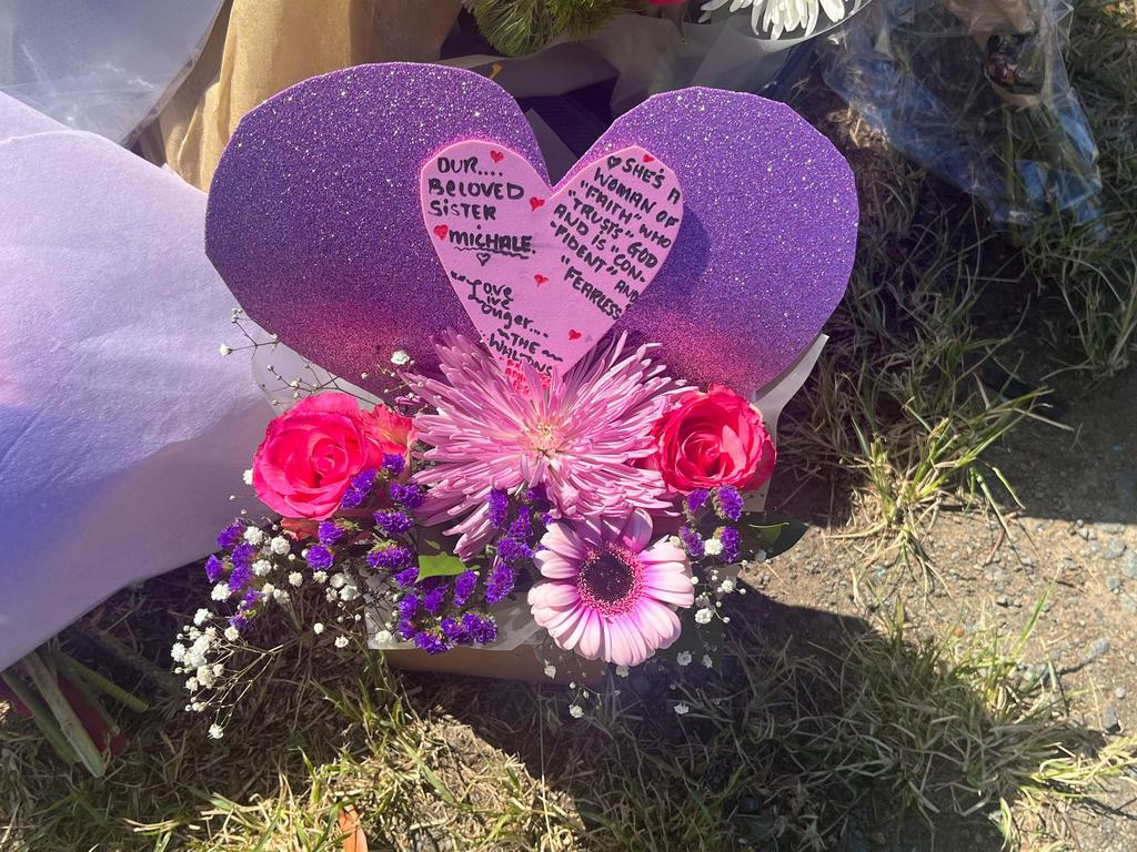 A heartfelt card dedicated to Michale Chandler sits at the crash site.