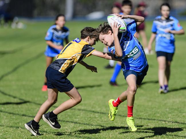 Bodhi Martin of Rockville State School gets a touch on Raiyn Hunt of Middle Ridge State School in the inaugural Primary Interschools Reconciliation Touch Carnival hosted by Glenvale State School, Wednesday, May 28, 2025. Picture: Kevin Farmer