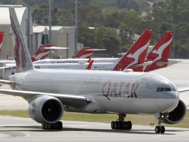 A Qatar Airways aircraft arrives with passengers from Italian cruise liners at Perth International airport in Perth, Monday, March 30, 2020. About 270 Australians are on board the flight, including 120 West Australians. No passengers with coronavirus symptoms were allowed to board.(AAP Image/Richard Wainwright) NO ARCHIVING