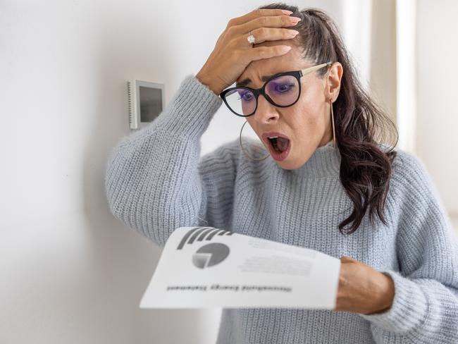 Woman is shocked from the rising energy costs and the bill she received for heat and electricity for her household.. Bill shock generic