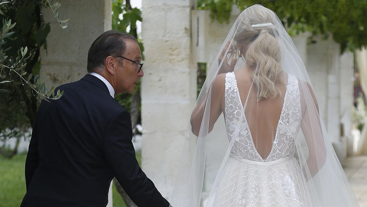 The Bachelor star was walked down the aisle by her father Les Heinrich. Picture: Matrix