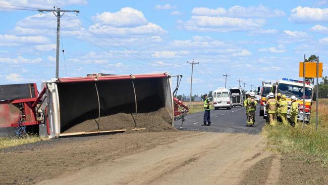 DIRT ROAD: Emergency services investigate the scene of a truck accident yesterday on Jandowae Road. Picture: Sam Flanagan