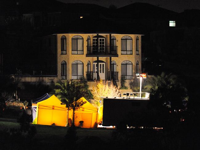 Police continue to investigate the scene of Friday's terrorist arrest.