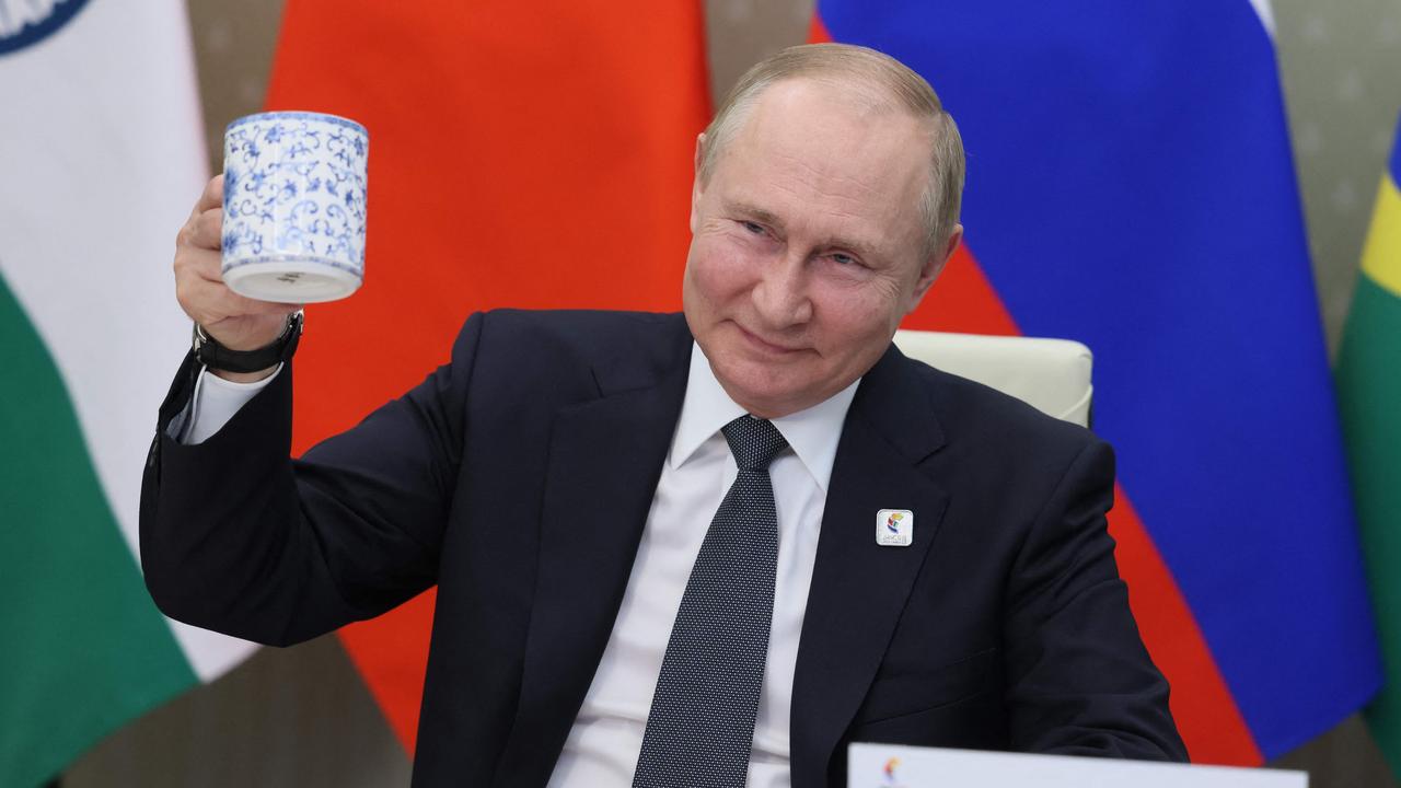 Russian President Vladimir Putin makes a toast as he takes part in the XIV BRICS summit in virtual format via a video call with China and India. Picture: AFP