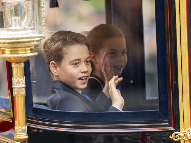 Prince George of Wales and Princess Charlotte of Wales wave during Trooping the Colour. Photo: Getty Images.