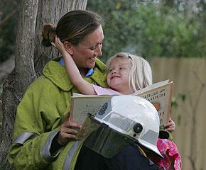 Working odd hours: Firefighter and single mother Suzannah Fussell and daughter Imogen, 3, take a break in the garden of their Perth home. Picture: Andy Tyndall