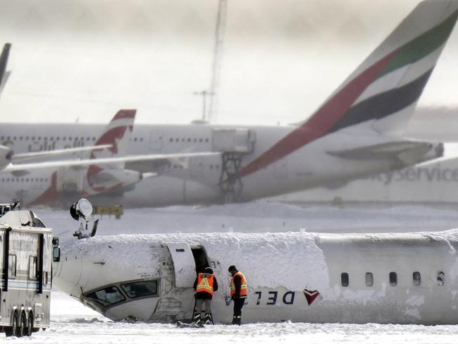 A Delta Air Lines plane lies upside down at Toronto Pearson Airport. Picture: Chris Young/The Canadian Press via AP