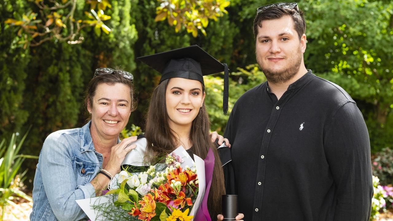 Bachelor of Business (Human Resource Management) graduate Chelsea Sawtell with Kerri Sawtell and Brayden Hughes at the UniSQ graduation ceremony at Empire Theatres, Tuesday, December 13, 2022. Picture: Kevin Farmer