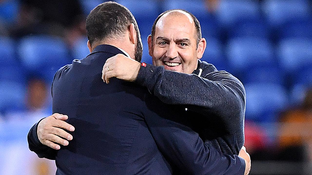 Pumas coach Mario Ledesma embraces Wallabies coach Michael Cheika.