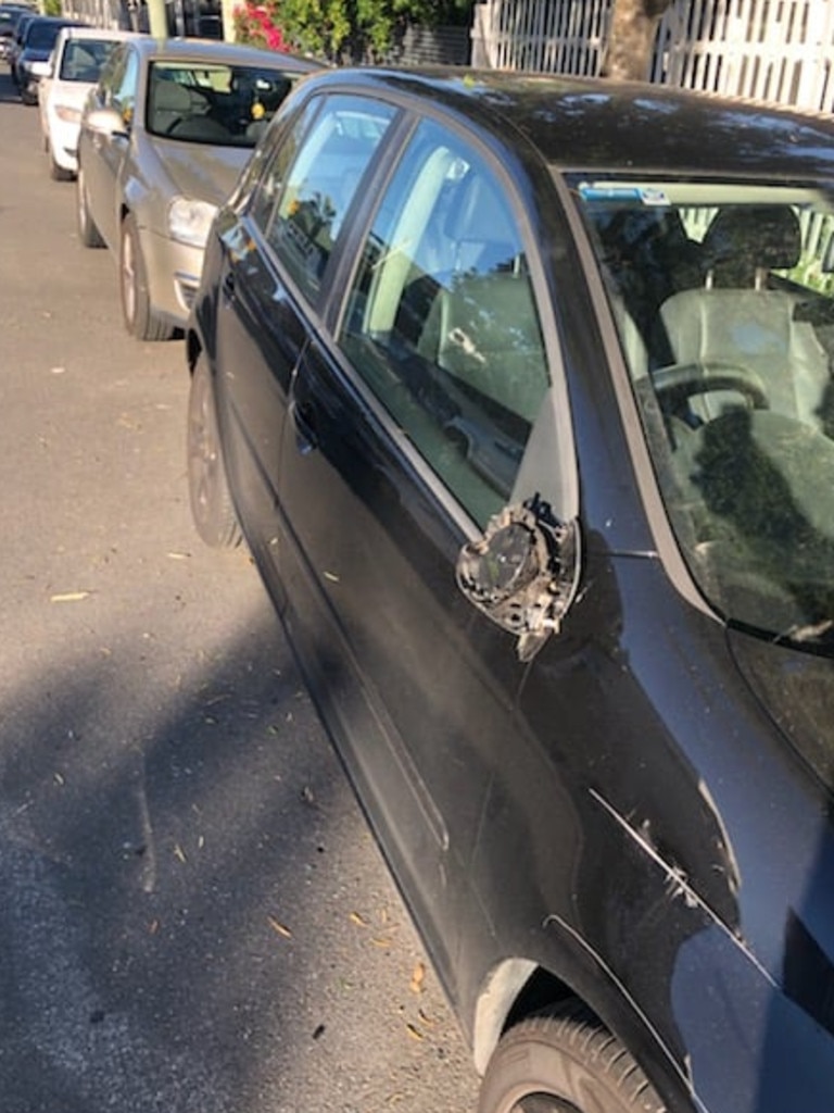 A side mirror smashed by a car passing in the narrow streets of Paddington.