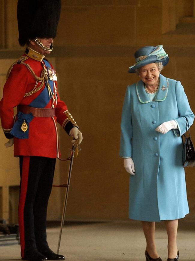 Britain's Queen Elizabeth II and her husband, Prince Phillip at the Queens Company Review at Windsor Castle in 2003. Picture: Supplied.