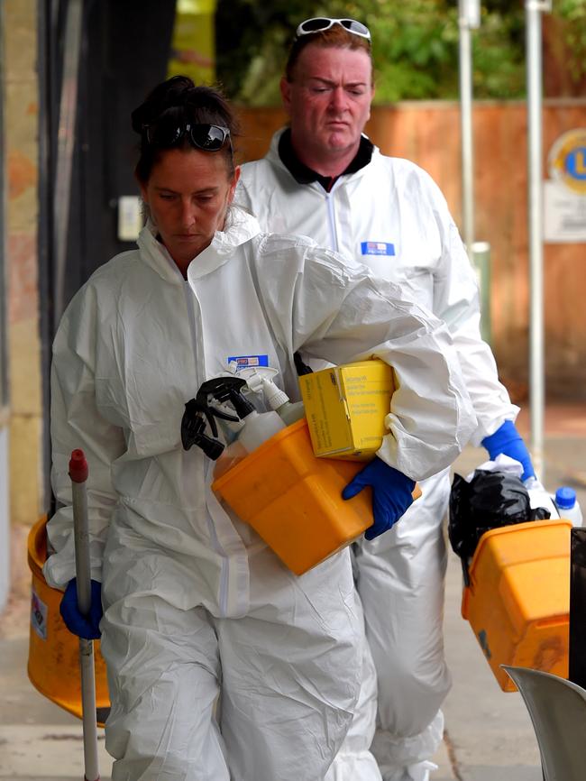 Crime scene cleaners at the store on Monday morning. Picture: Nicole Garmston