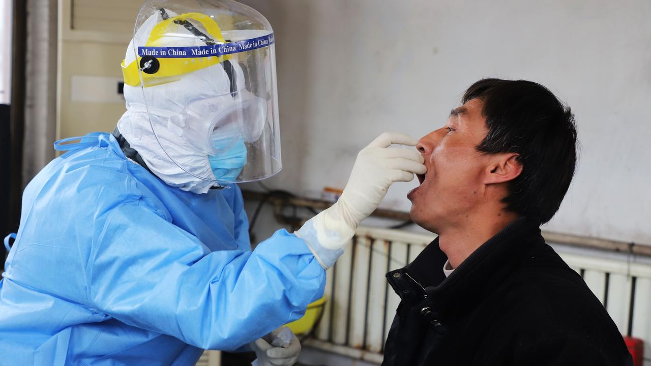 Testing of the coronavirus involves taking swabs from people’s throat or nose. Picture: STR/AFP/China OUT