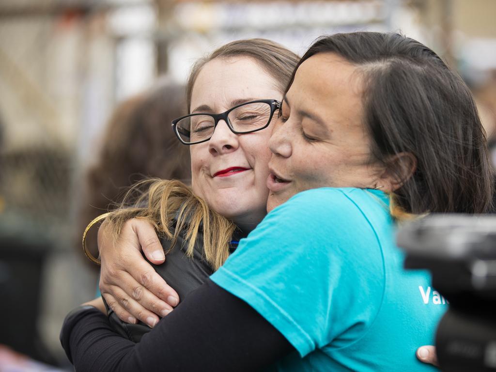 Jessica Munday, Secretary of Unions Tasmania hugs one of the Big Steps participants before the annual May Day march in Hobart. Picture: RICHARD JUPE