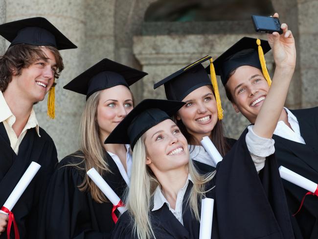 Close-up of five graduates taking a picture of themselves