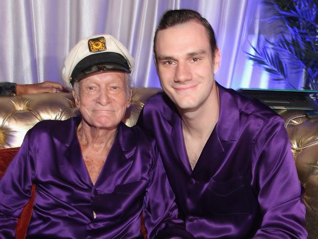 The late Hugh Hefner and his son Cooper at the Playboy Mansion in 2014. Picture: Christopher Polk/Getty Images for Playboy