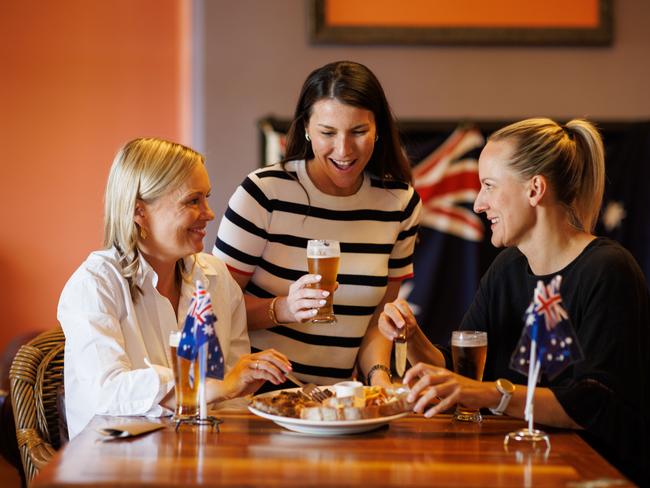 Sara Rehn, Mariele Fretta and Felicity Rowe at the Kent Town Hotel with the Australia Day Mixed Grill.  Picture Matt Turner.