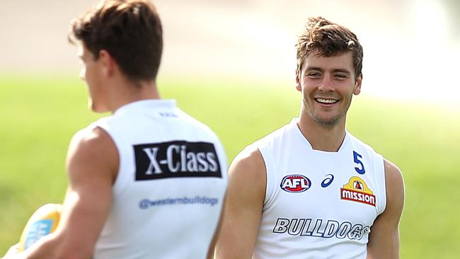 Josh Dunkley, right, failed to live up to the expectations of SuperCoaches in Round 1. Picture: Graham Denholm/Getty Images