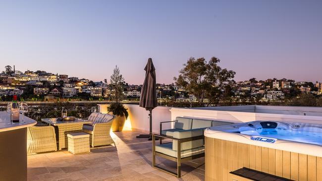 One lucky buyer can enjoy sipping wine from the wet bar while relaxing in the jacuzzi at 38 Portside Place, Bulimba.