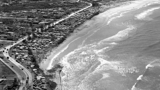 Kirra Beach showing how swimmers move across gutters to find waves. .