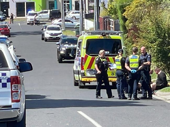 Police remove a man from a home after a siege in Mornington. Picture: Lucy Callander