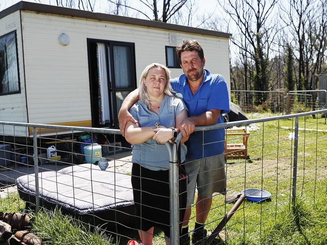 Dan Jansch and partner Alisha Stoneham pictured in the temporary home they have been living in since the fires in Lake Conjola. Picture: Sam Ruttyn