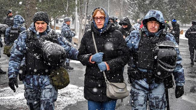 Police detain a woman during a protest in Moscow’s Zaryadye Park, a short distance from the Kremlin, on Saturday. Picture: AFP