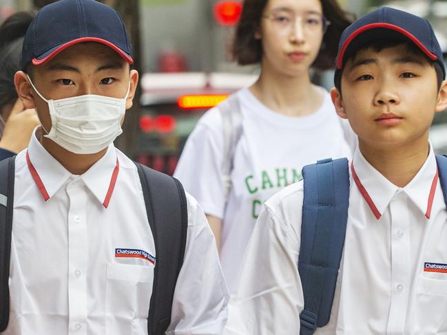 Students head back to school in Chatswood, Sydney on Wednesday. Those recently returned from China have been asked to stay at home for two weeks. Picture: Jenny Evans/Getty Images