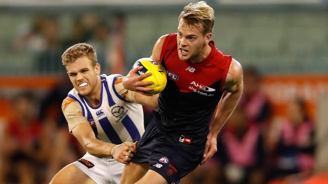 Jack Watts is tackled by Ed Vickers-Willis.