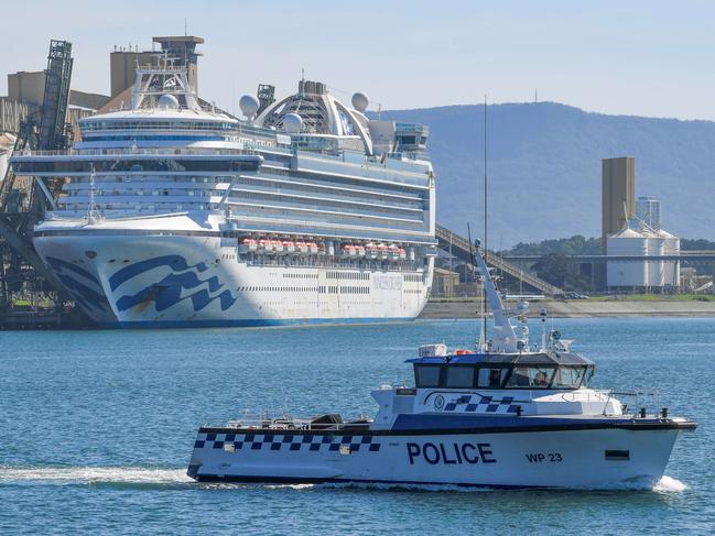 Water police patrol the contaminated cruise ship Ruby Princess while it was berthed in Port Kembla south of Sydney. Picture: Simon Bullard.