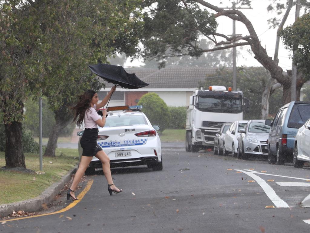 Severe storms line up Sydney this afternoon a funnel cloud appears south of Chester hill and rain and wind hit streets of Chester hill. Picture: John Grainger