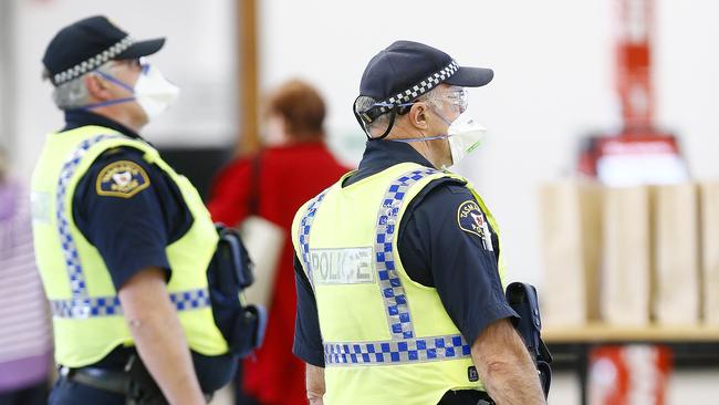 Tasmania Police officers are assisting Biosecurity Tasmanian staff at Hobart Airport. Picture: MATT THOMPSON