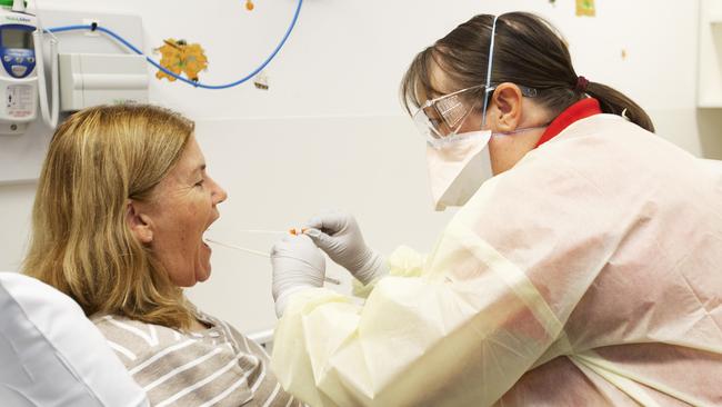 Janice Geary (clinical nurse consultant, Infection Management Service) demonstrating patient check for COVID-19 coronavirus at the The Prince Charles Hospital in Brisbane. Picture: Attila Csaszar/AAP